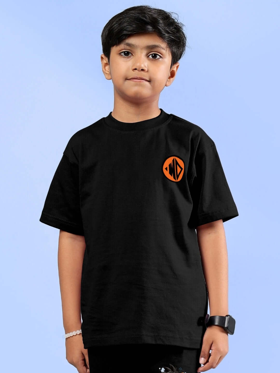 Boy wearing black Goku printed t-shirt for kids, unisex design, perfect casual wear, customizable size options available.