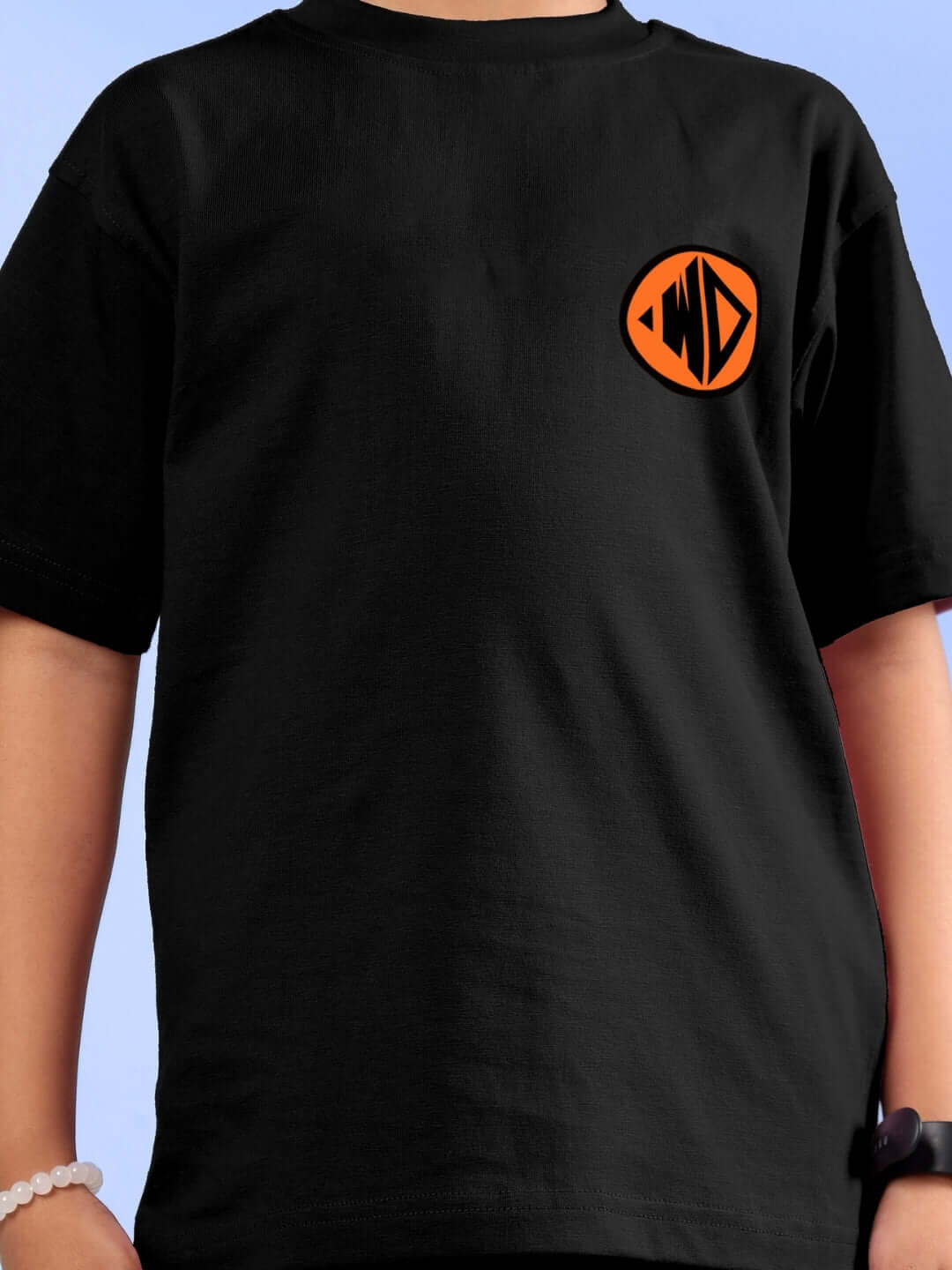 Black Goku printed t-shirt for boys and girls by DUDS, featuring an orange emblem on the chest.