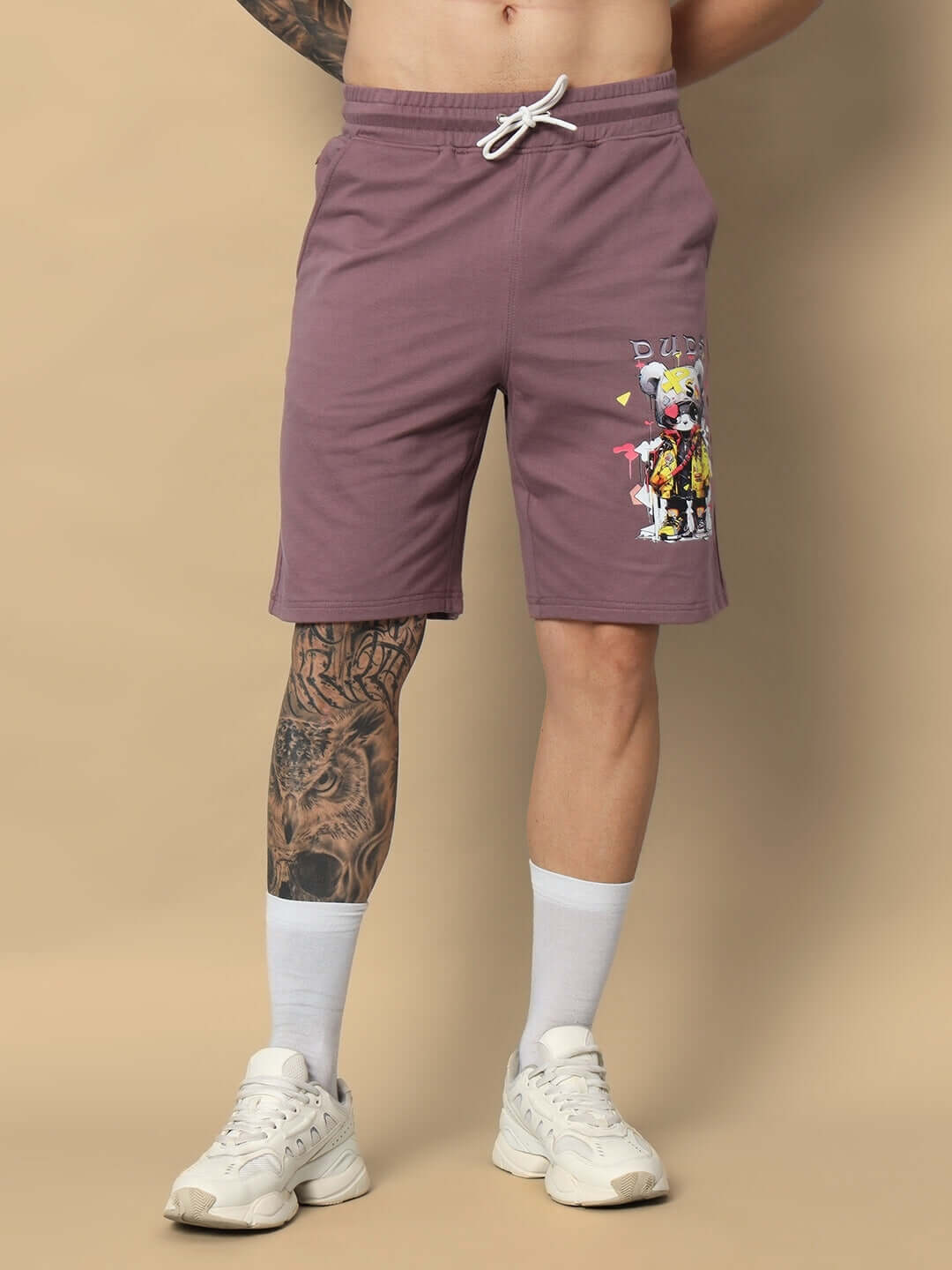 Model wearing COOL TEDDY regular fit shorts in Chinese Violet, featuring customized fit option, with graphic design on thigh.