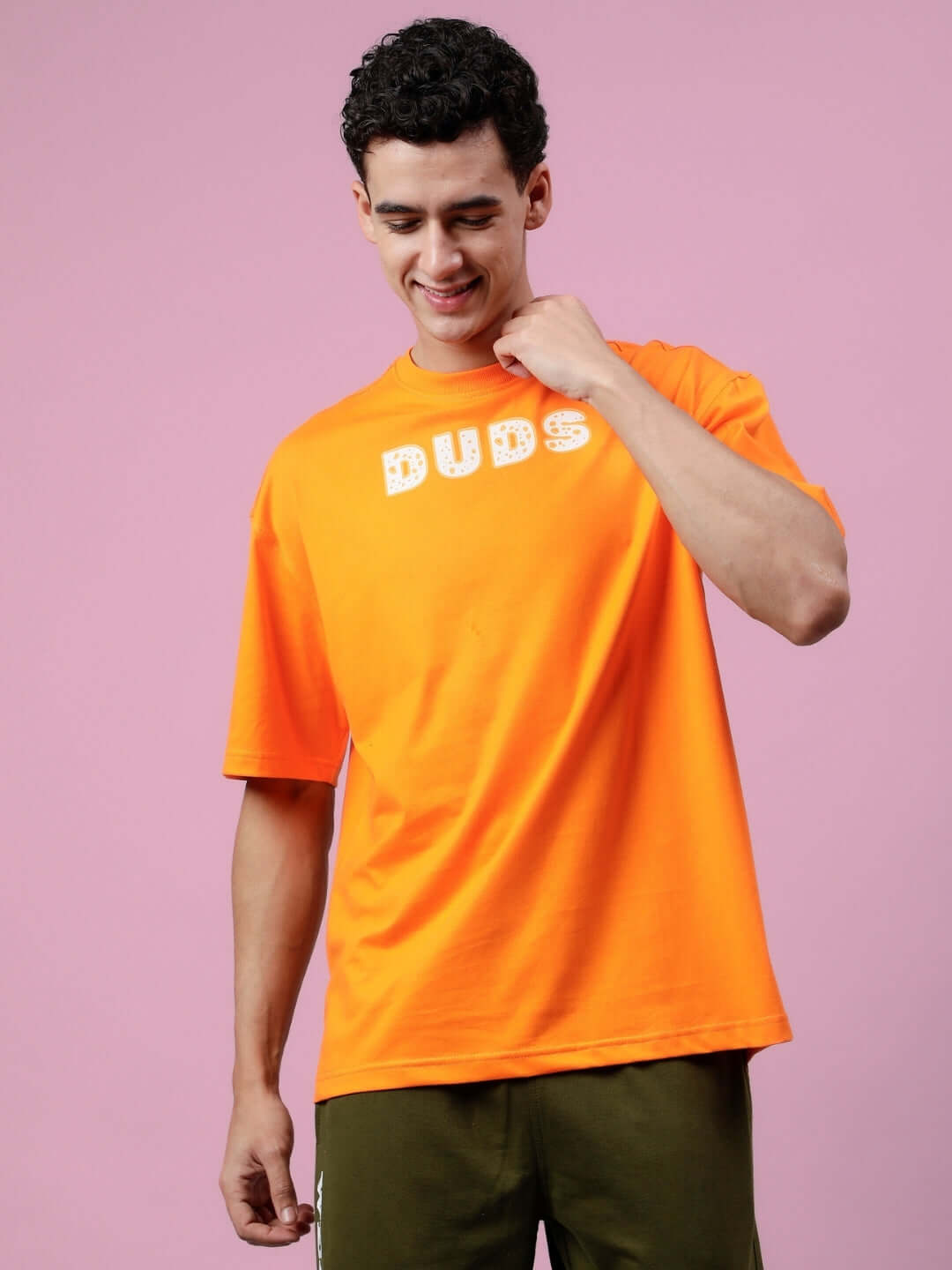 Courage over-sized t-shirt in orange by DUDS, shown on model, customizable for prepaid orders. Handmade with dedication.