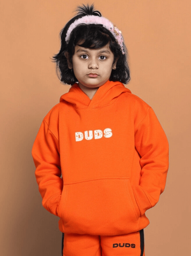Child wearing Courage Oversized Hoodie Boys & Girls Orange, soft and durable for everyday comfort.