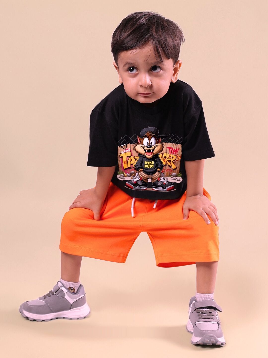 Child wearing a black and orange Crazy Rapper co-ord set, featuring street-style fashion with character graphics, perfect for young trendsetters.