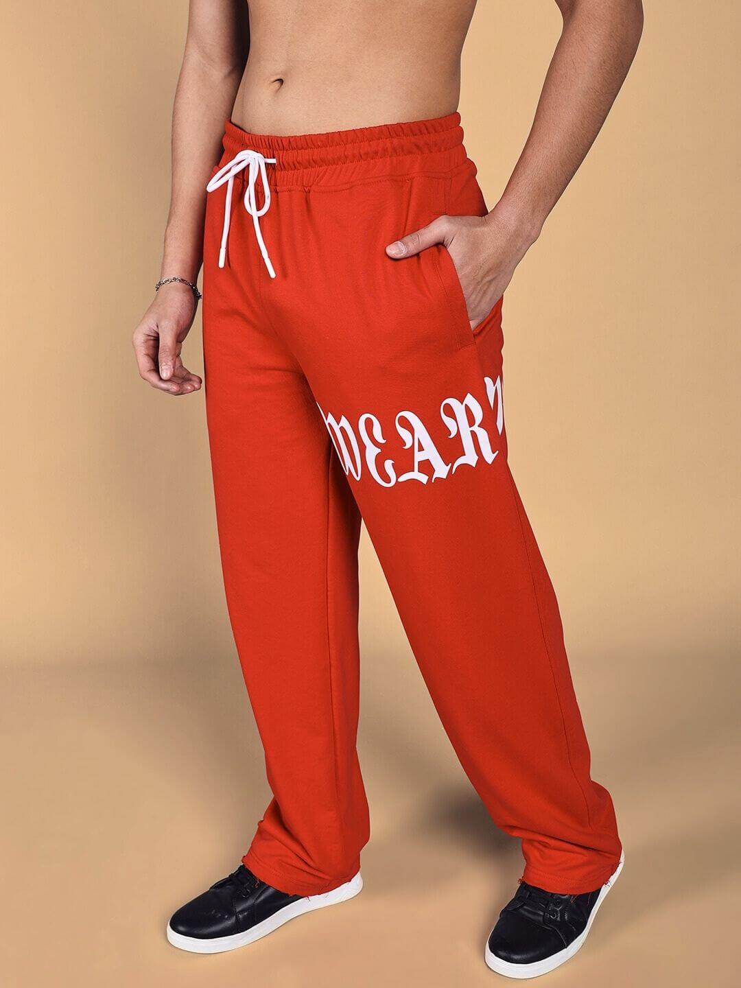 Person wearing Crimson Relaxed Fit Jogger in red, featuring a comfortable design with drawstring waist and side pockets.