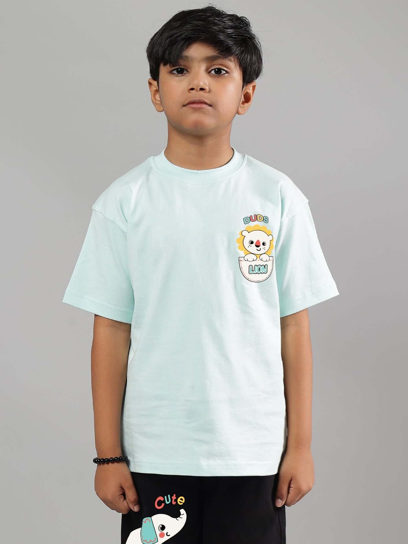Boy wearing a sky blue cute elephant t-shirt made by DUDS, showcasing playful design for boys and girls.