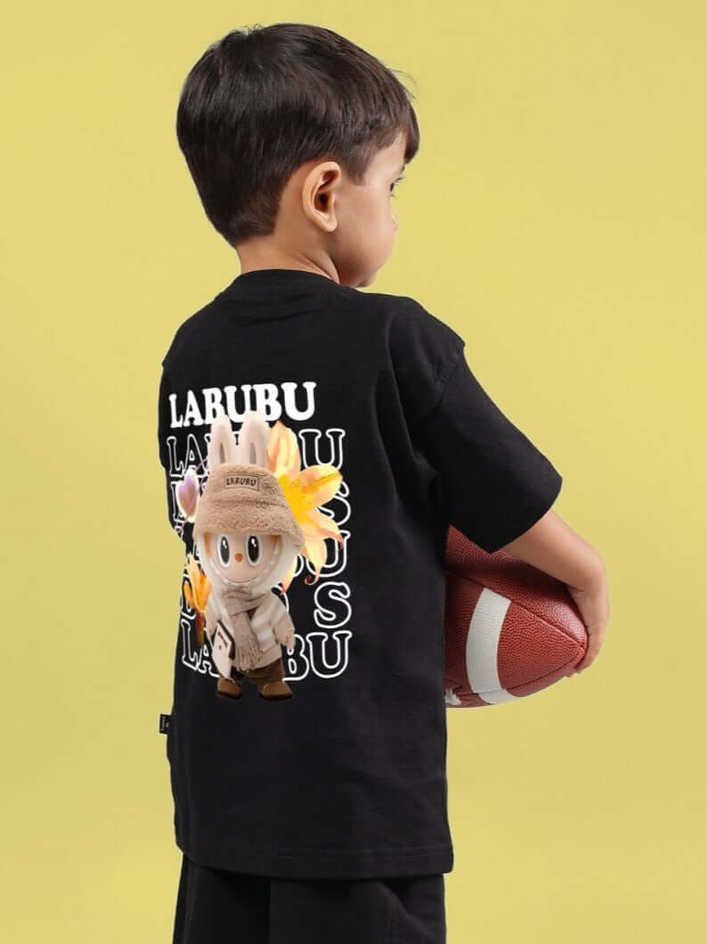 Young boy wearing black cute monsters t-shirt holding a football, showcasing vibrant graphic design on the back. Perfect for boys & girls.