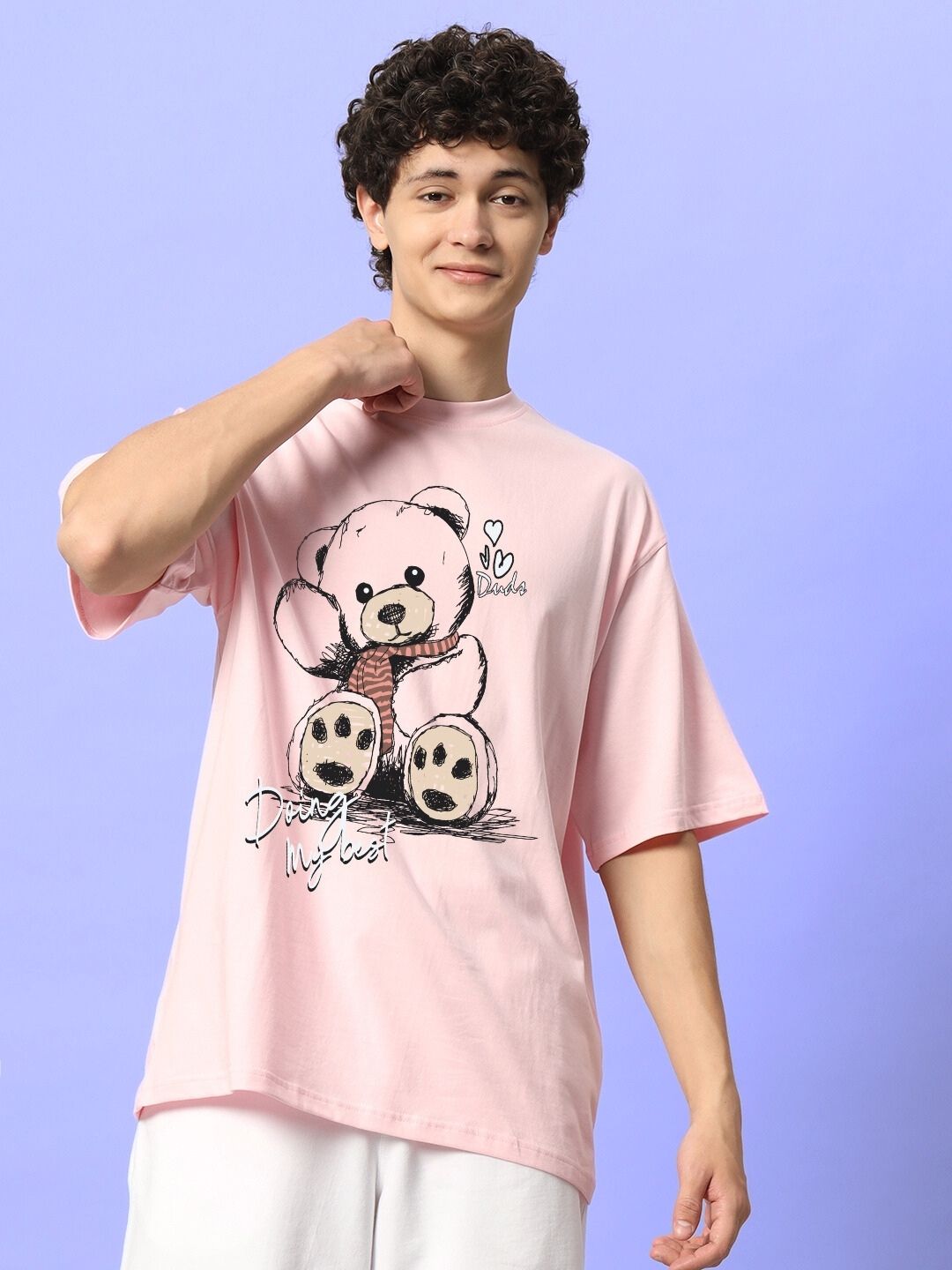 CUTE BEAR OVERSIZED T-SHIRT PINK worn by model against purple background