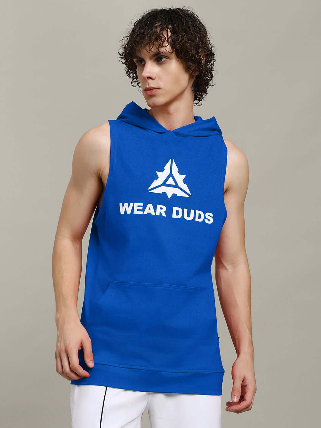 Model wearing a blue CYBRAN GYM hooded T-shirt by DUDS, available with custom fit options for tailored comfort and style.