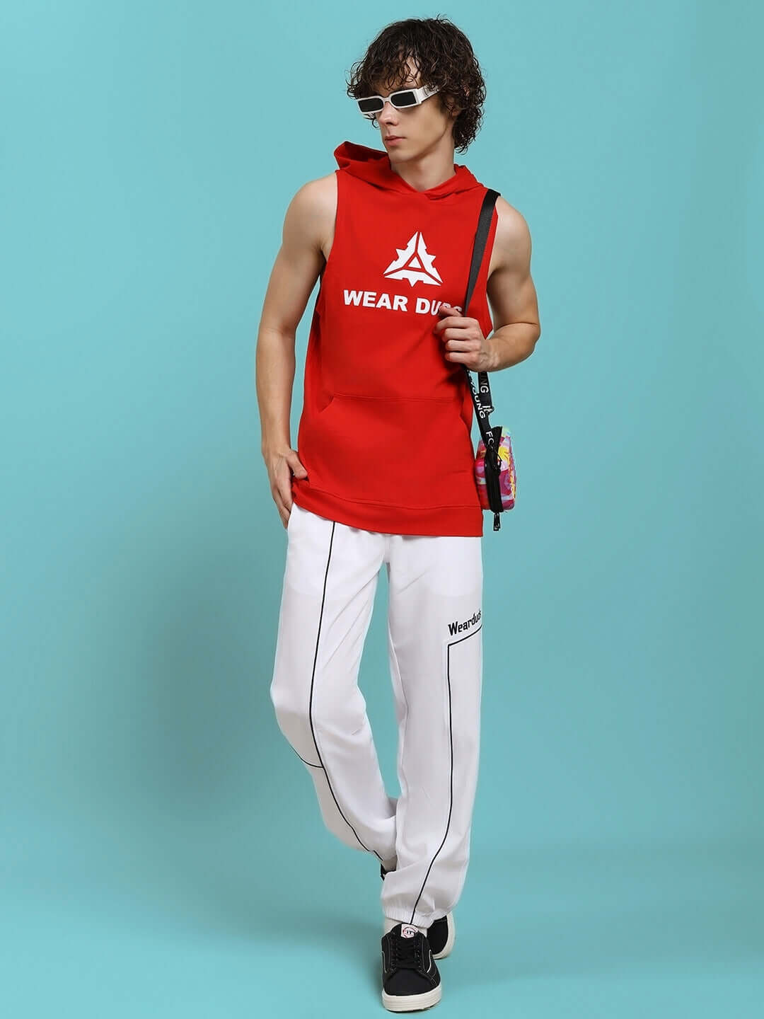 Man wearing CYBRAN GYM HOODED T-SHIRT - RED, sporty and stylish look, ideal for workouts and streetwear fashion.