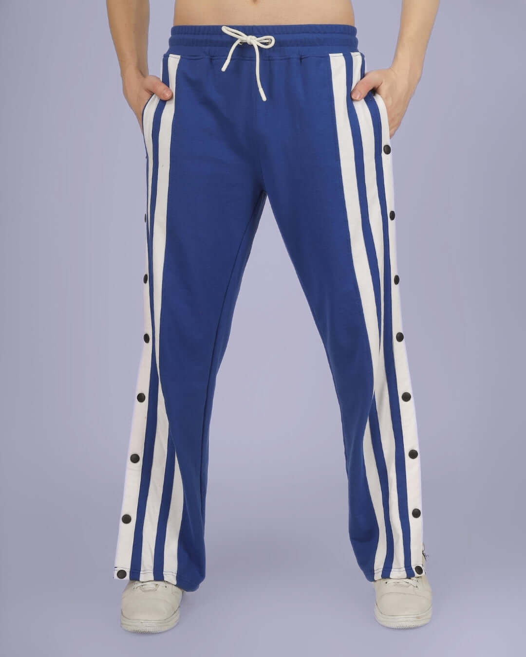Person wearing Royal Blue Dancer Joggers with side stripes and button details, showcasing comfortable and stylish loungewear by DUDS.
