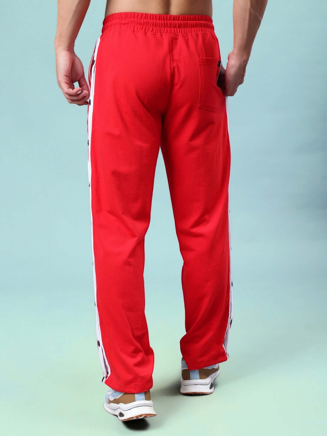 Back view of DANCER JOGGERS in red-white color, made to order by DUDS, showcasing premium tailoring and elastic waistband.