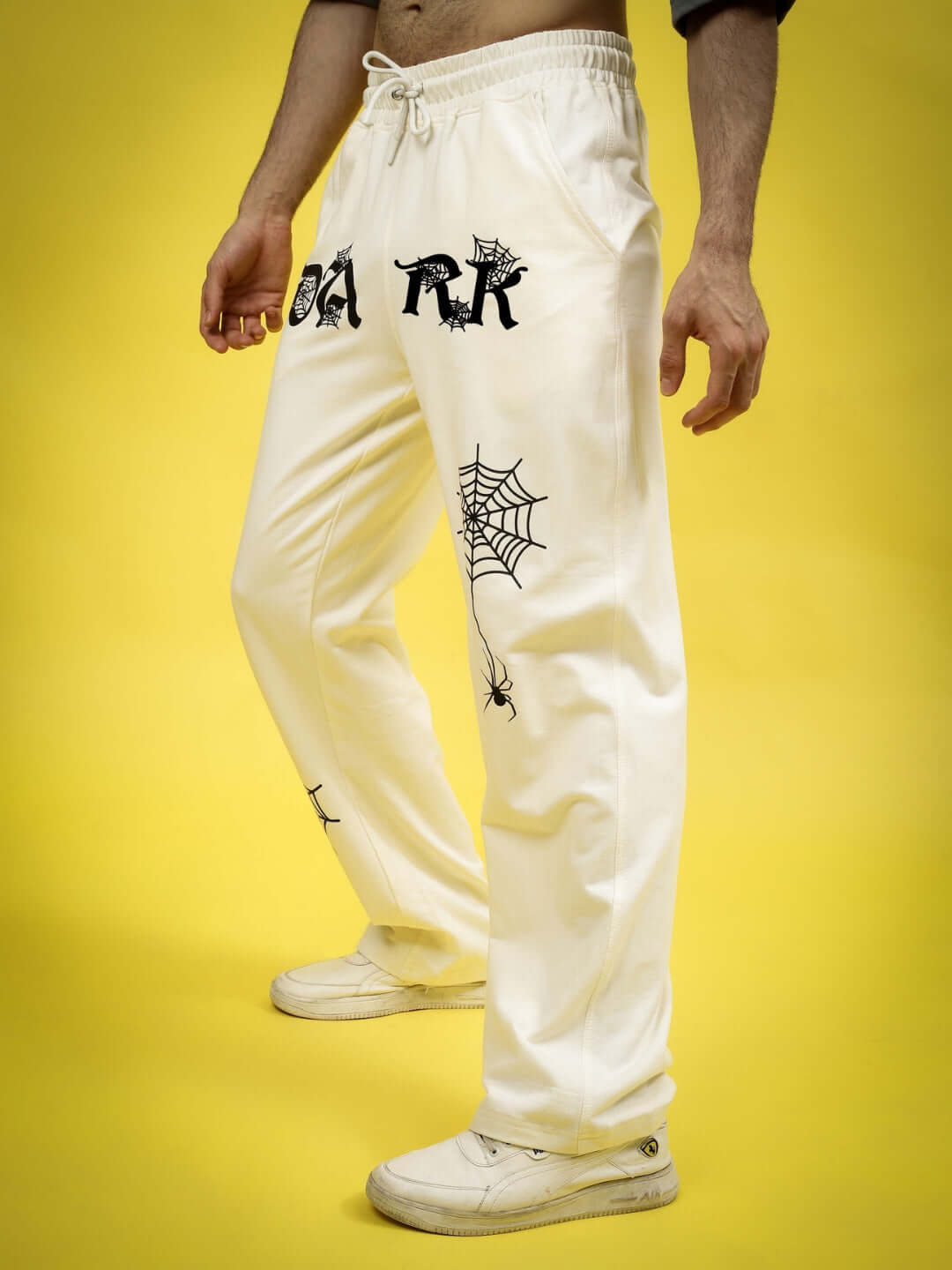 Off-white DARK WEB Relaxed Jogger Pants with spider web graphics, tailored for comfort, available in custom sizes from DUDS.