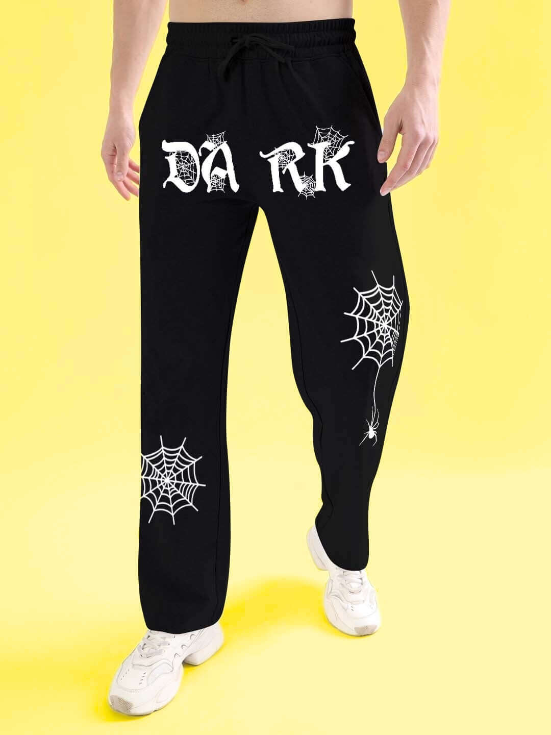 Model wearing black DARK WEB Relaxed Jogger with spider web graphics, tailor-made by DUDS. Customizable sizes, available for prepaid orders.