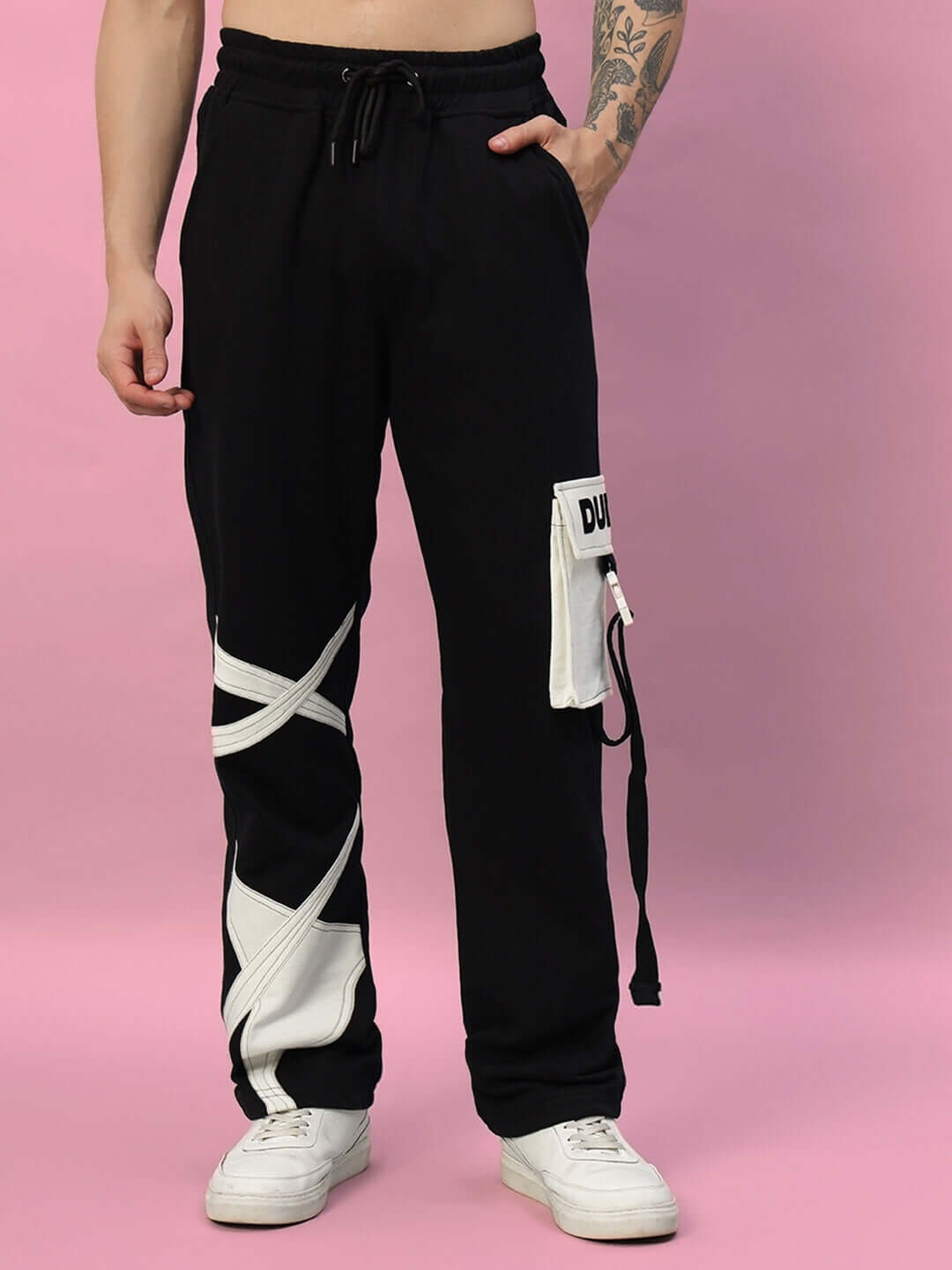 Model wearing black DAVID JOGGER pants with white accents, highlighting the customizable tailor-made design by DUDS.