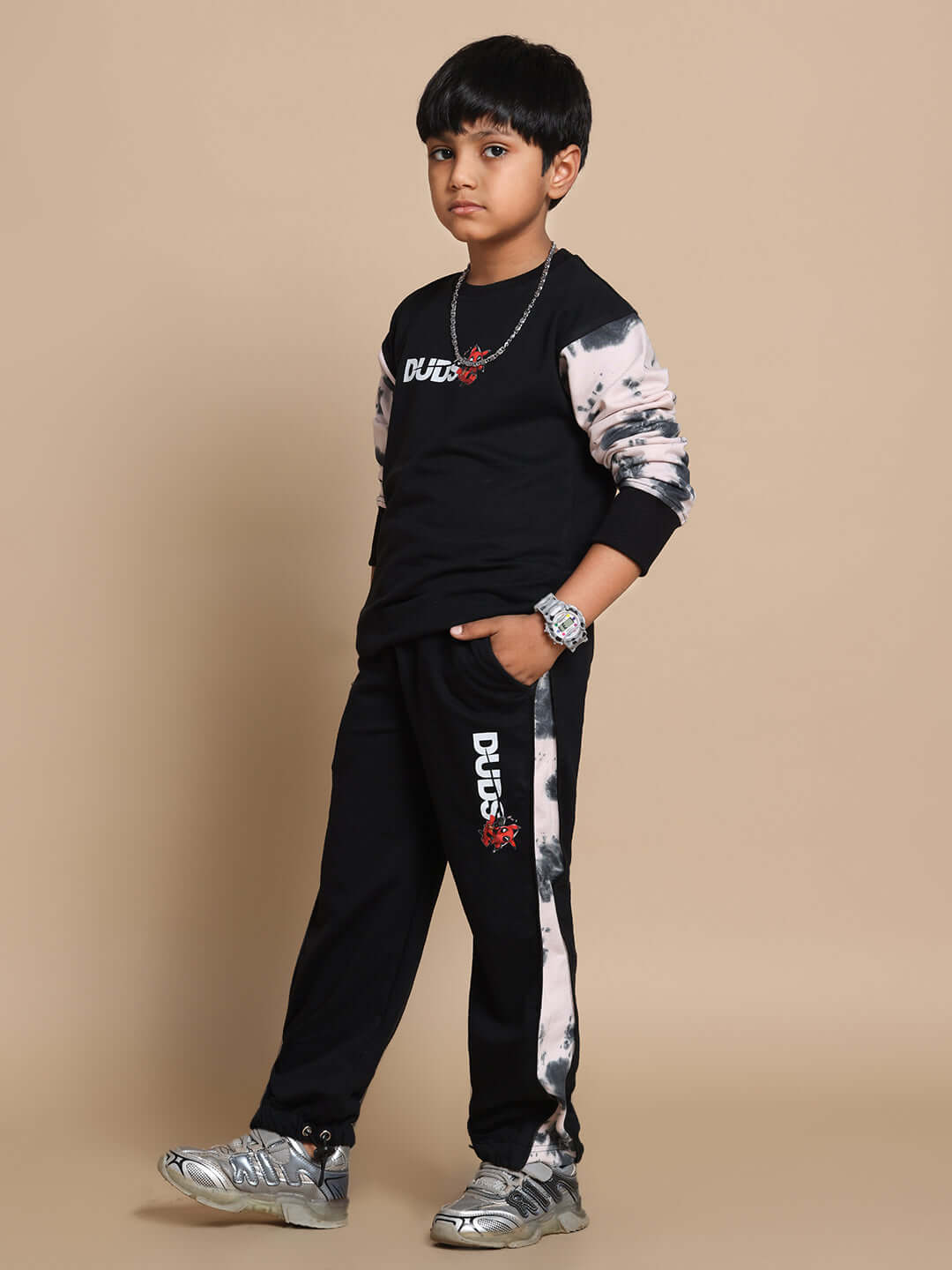 Child wearing Deadpool co-ord set in black-beige by DUDS, perfect for boys and girls. Stylish, made-to-order design offering custom fit.
