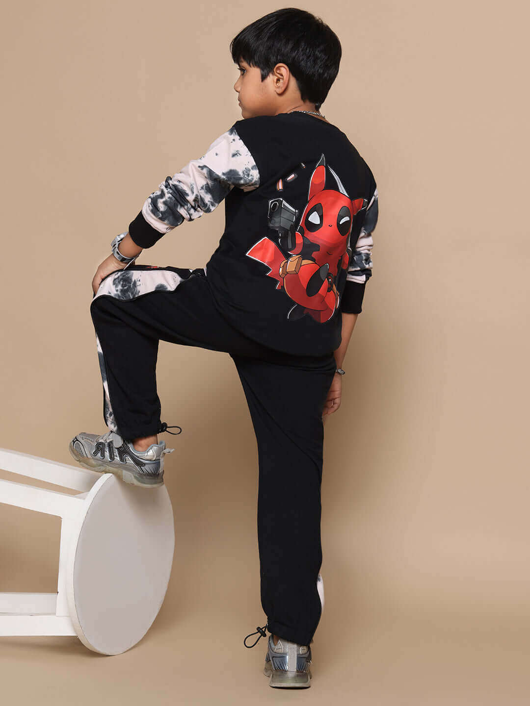 Child wearing a black and beige Deadpool co-ord outfit with custom fit options available.