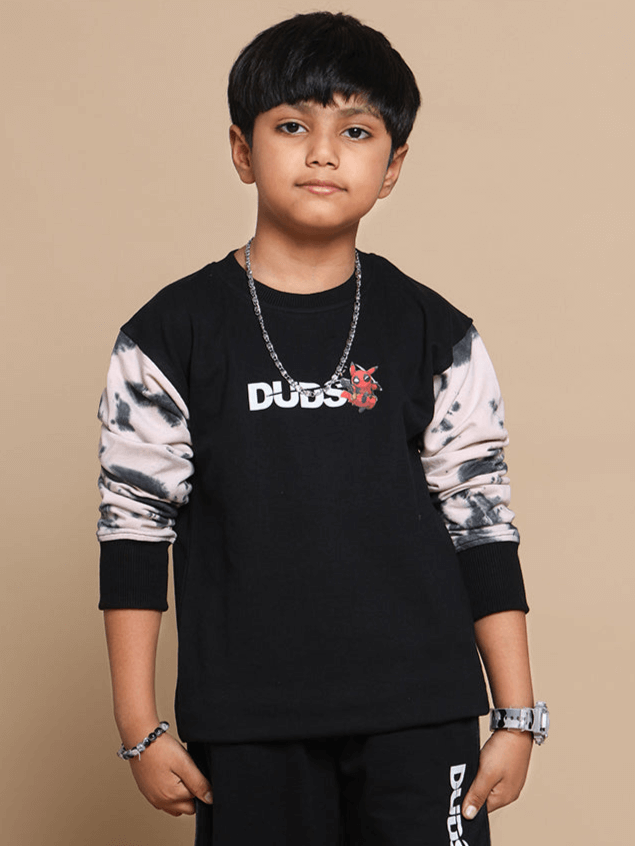 Boy wearing a black Deadpool oversized sweatshirt by DUDS, featuring unique sleeves. Ideal for custom fit and tailored craftsmanship.