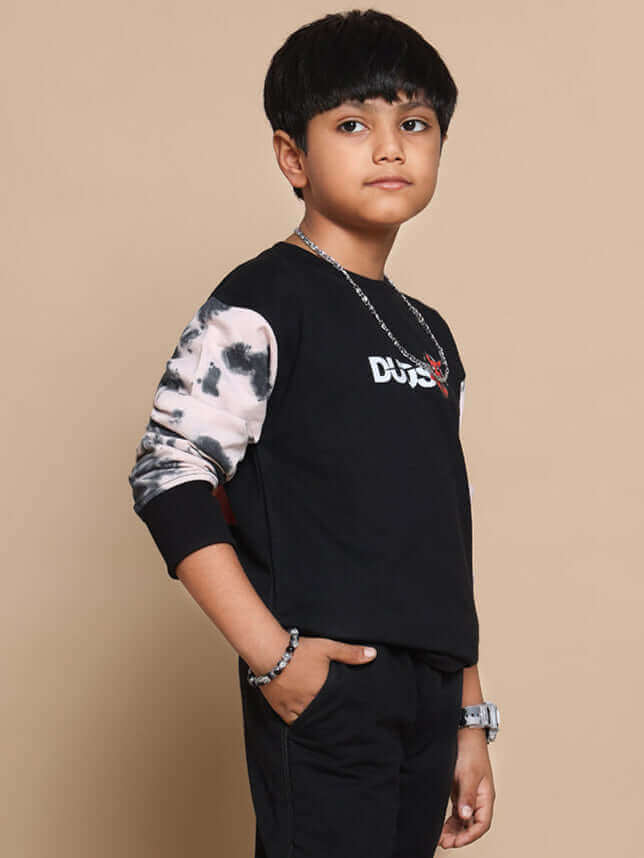 Young boy wearing black-beige Deadpool-themed co-ord set with custom fit option from DUDS.