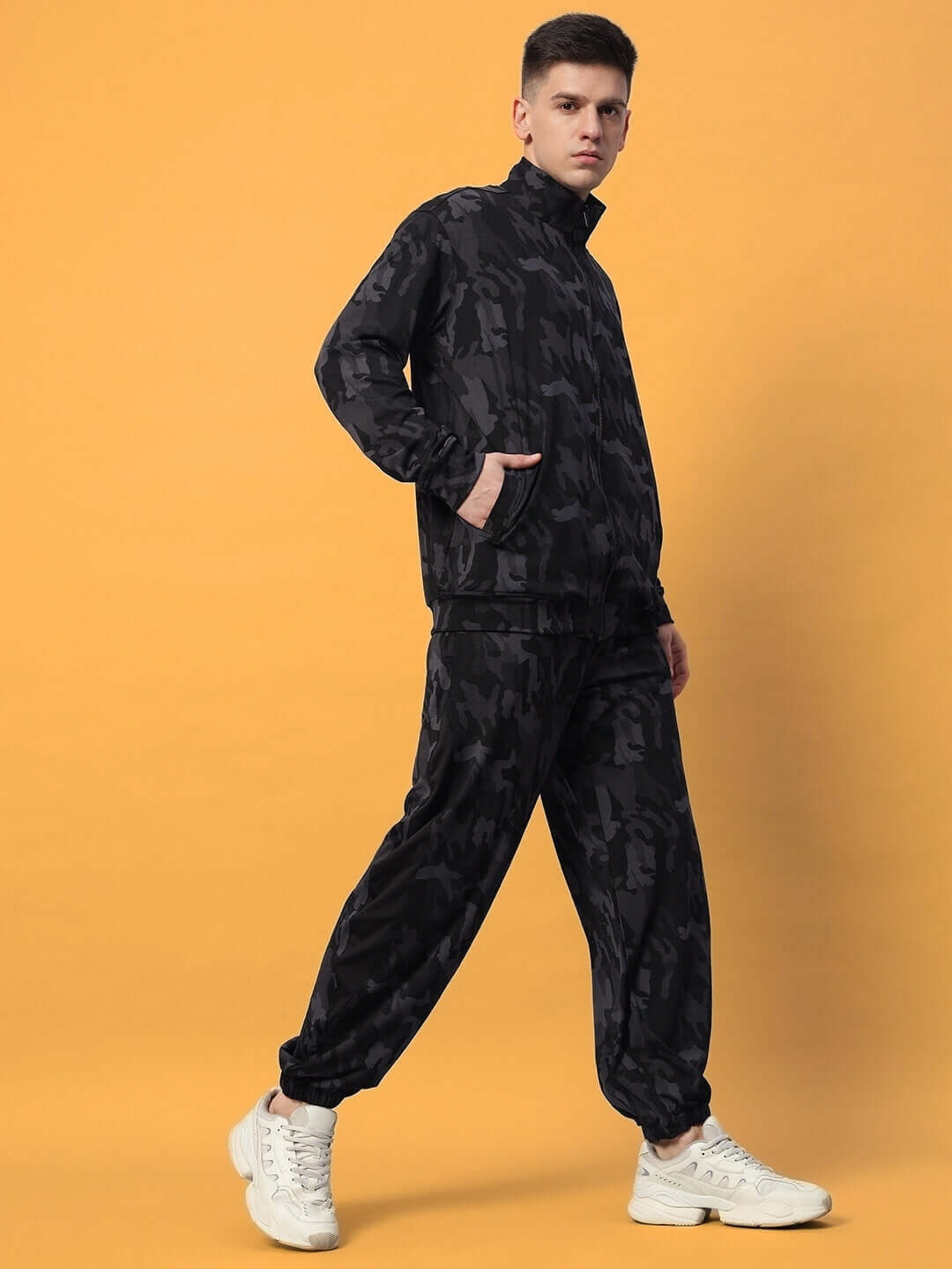 Model wearing DEFENCE CO-ORD SETS CAMOUFLAGE NAVY, combining urban and military style in camo navy print.