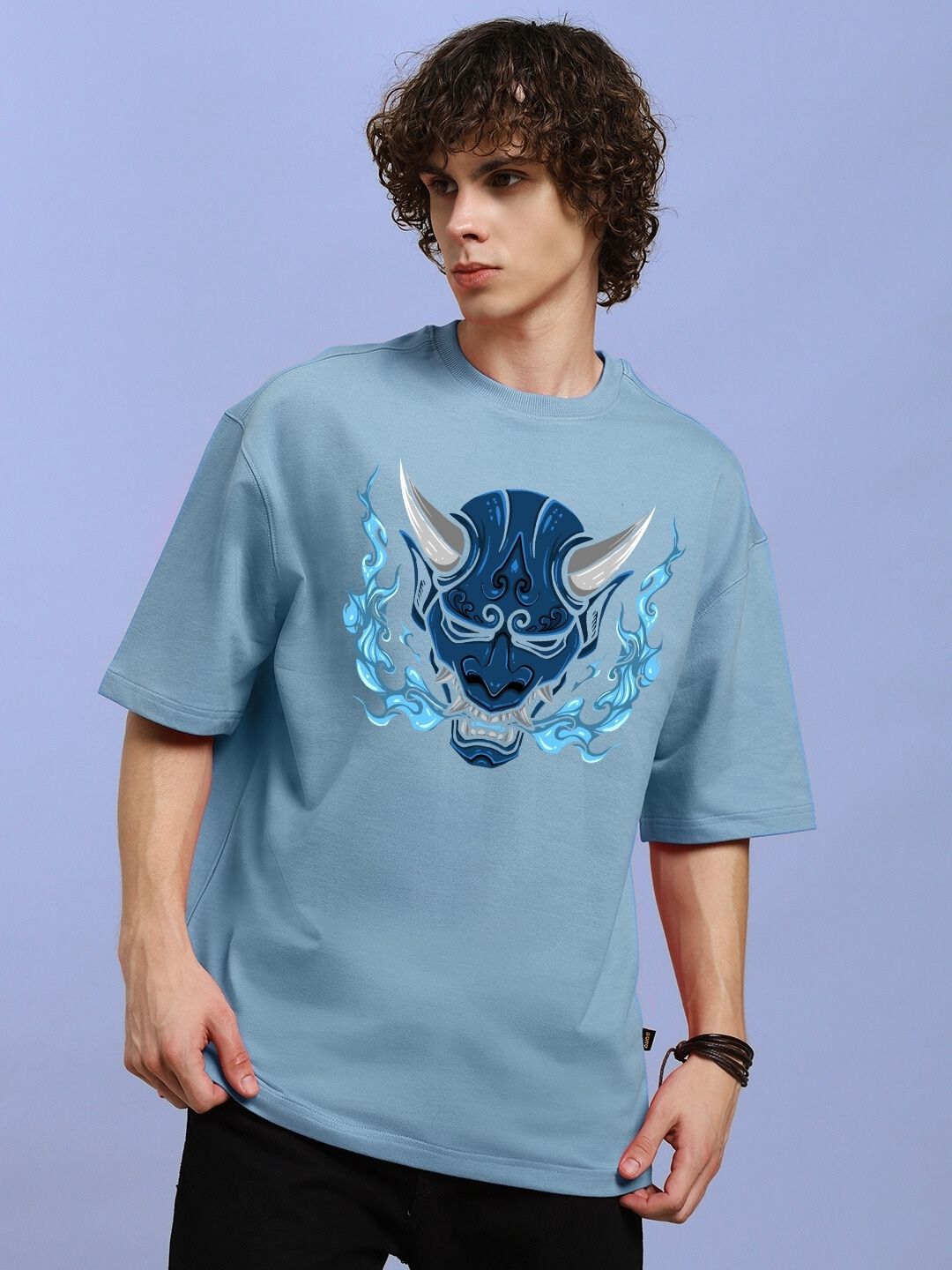 Man wearing DEMON PRINTED OVER-SIZED T-SHIRT LIGHT BLUE with demon graphic design.