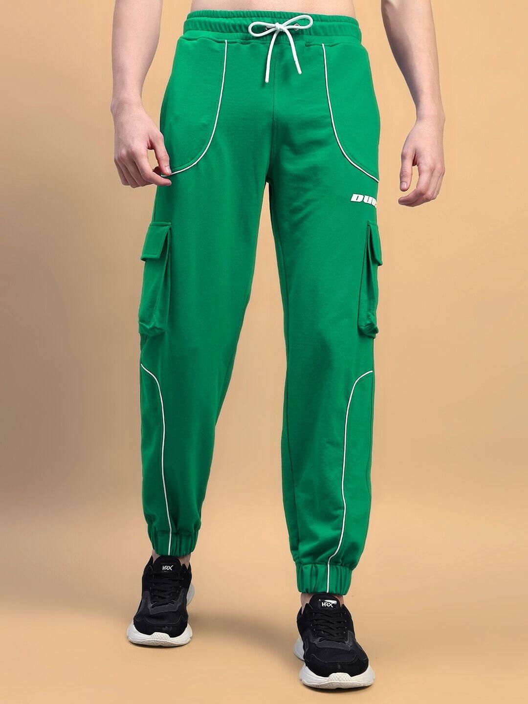 Model wearing Deveno relaxed-fit green joggers with cargo pockets, showcasing style and comfort.
