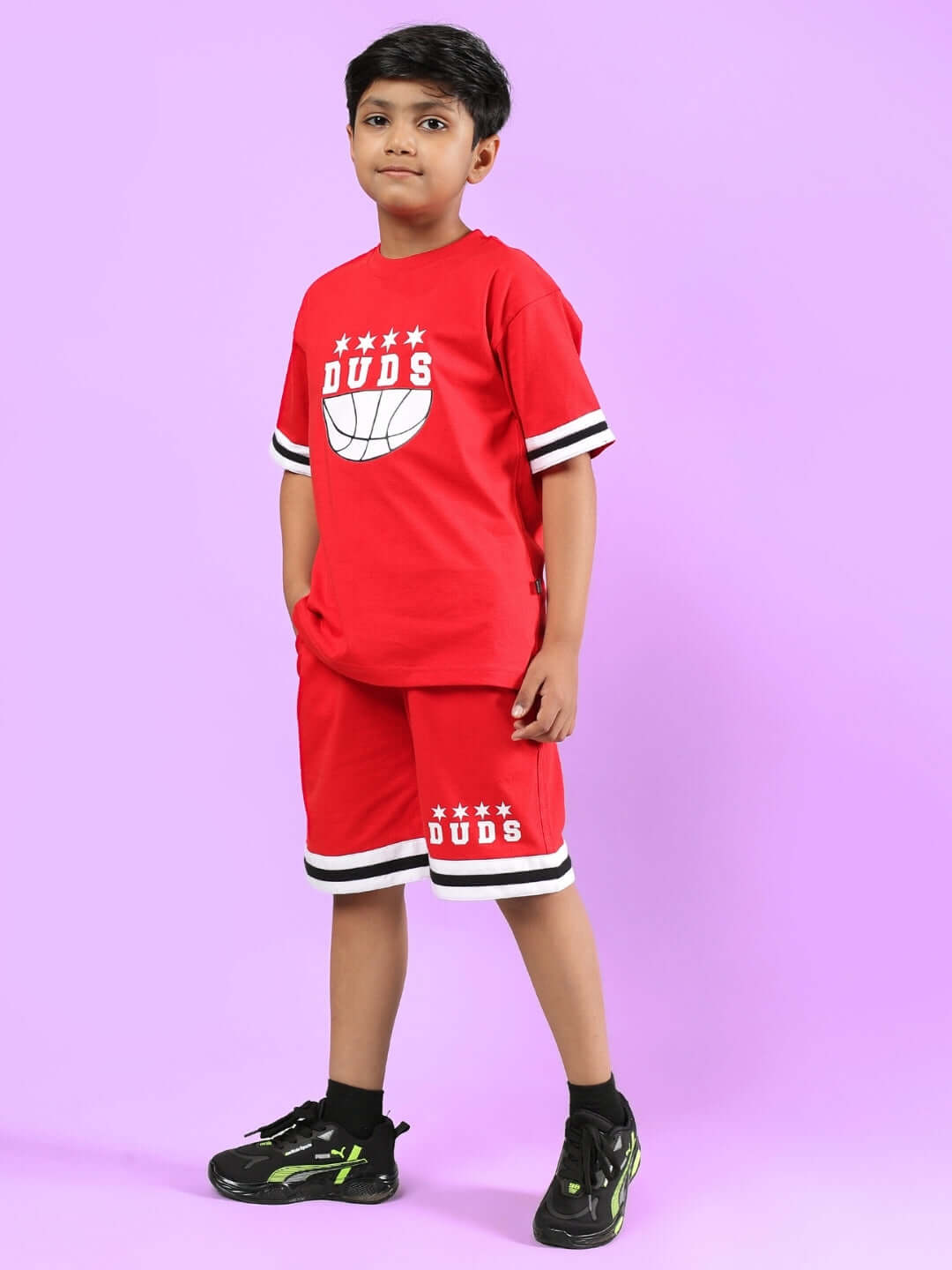 Child wearing DIGGIN CO-ORD FOR BOYS & GIRLS RED set by DUDS on purple background