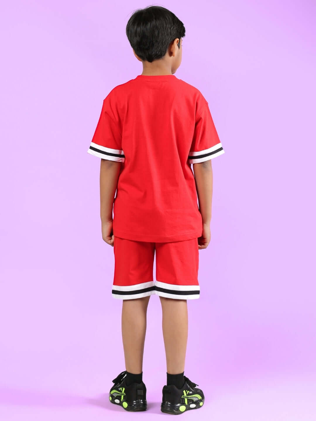 Child wearing DIGGIN CO-ORD FOR BOYS & GIRLS RED, featuring a comfortable red top and shorts with white and black trim, back view.