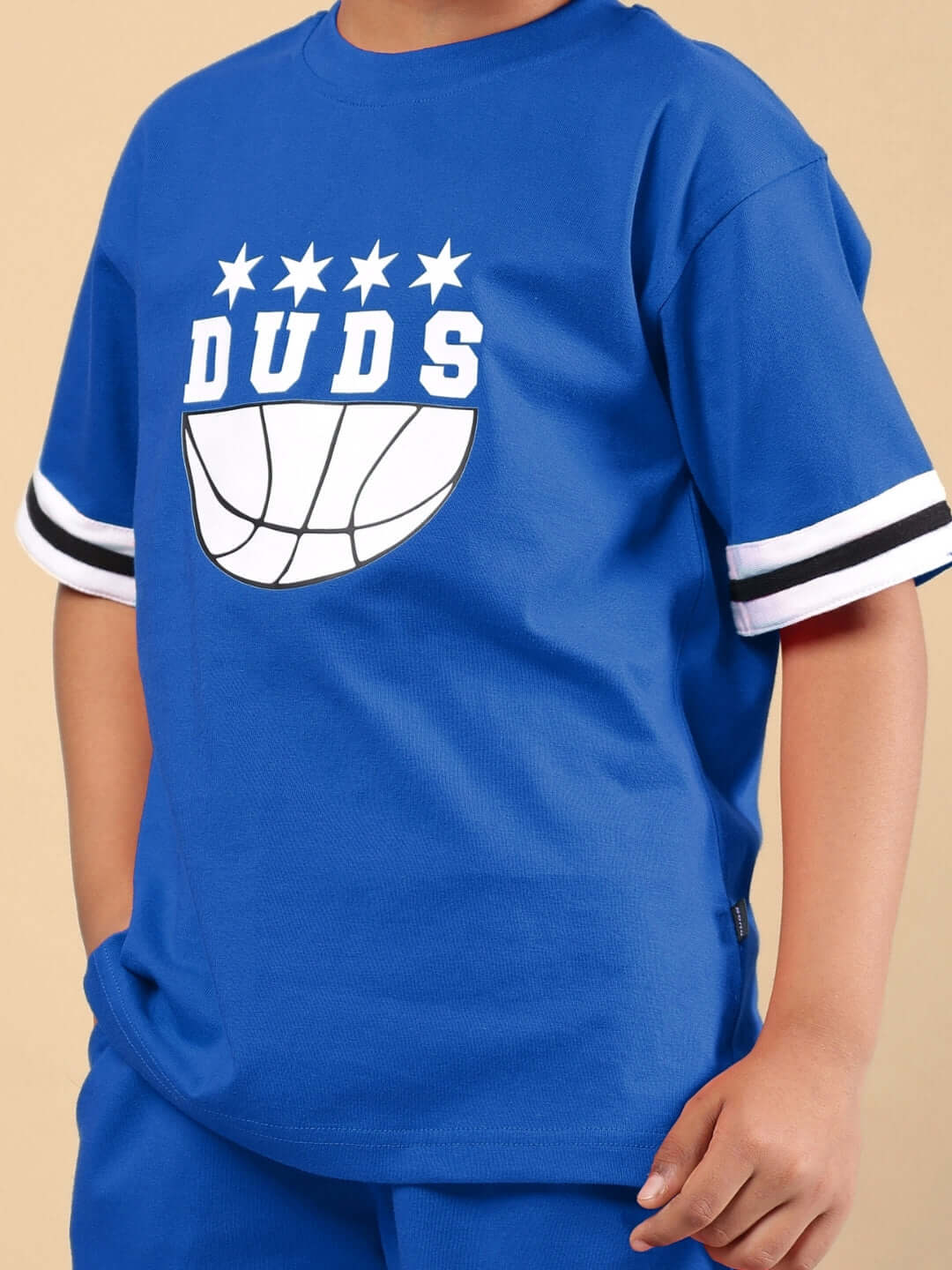 Child wearing DIGGIN CO-ORD FOR BOYS & GIRLS BLUE set with DUDS logo.