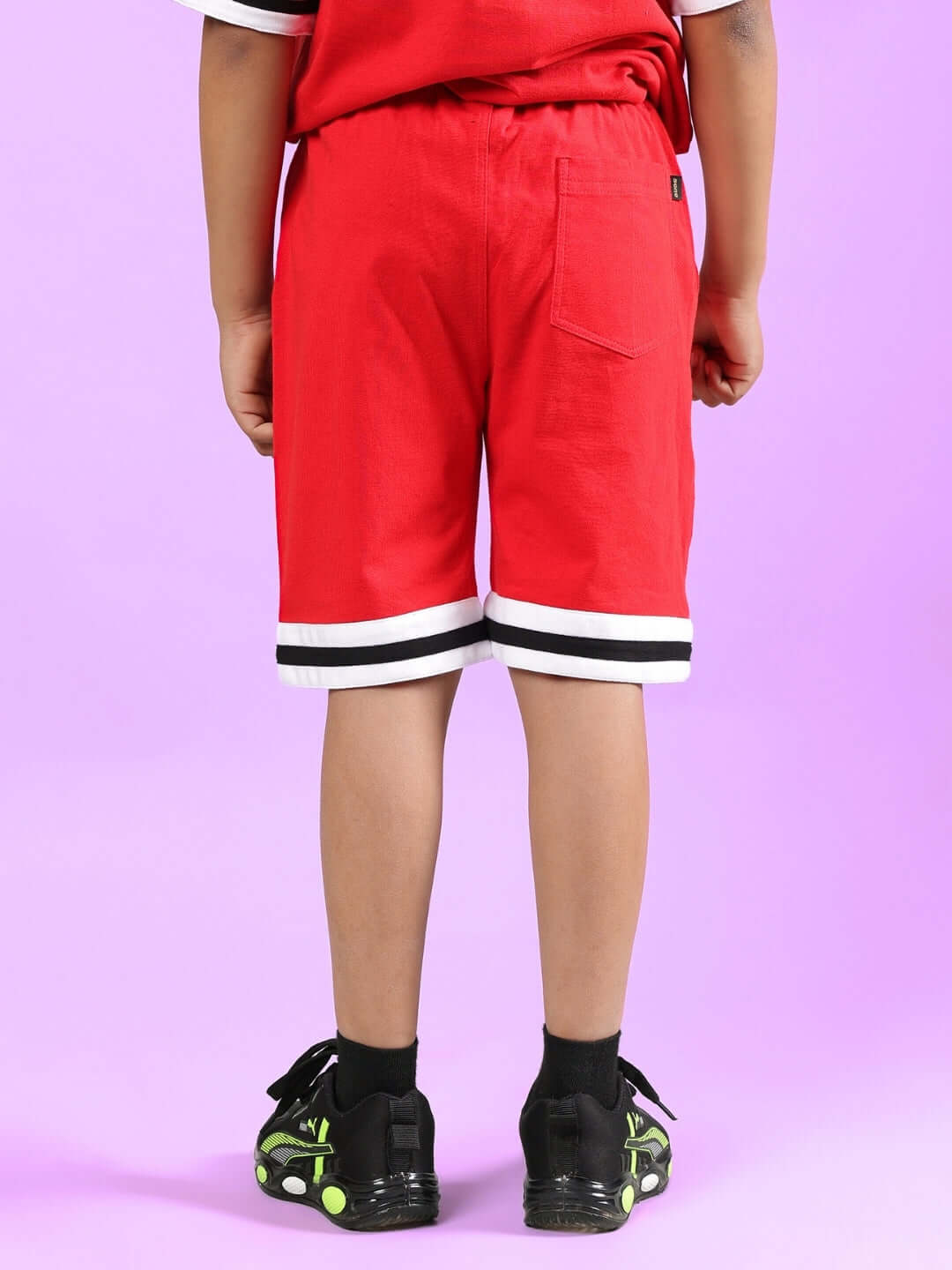 Child wearing DIGGIN SHORTS FOR BOYS & GIRLS RED, showcasing comfy fit and vibrant color. Ideal for made-to-order summer outfit.