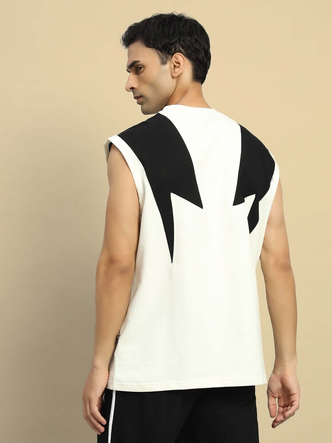 Back view of an off-white Dino Thunder oversized t-shirt with black graphic design, made from premium cotton and elastane blend.