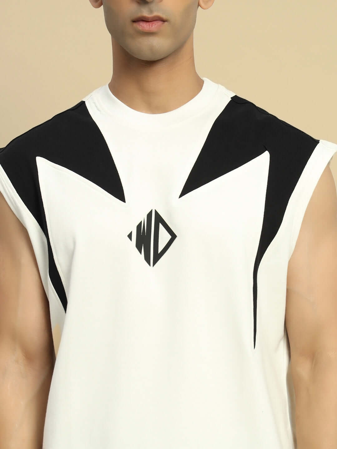 Model wearing DINO THUNDER over-sized off-white T-shirt with black geometric design, made of premium cotton and elastane blend.