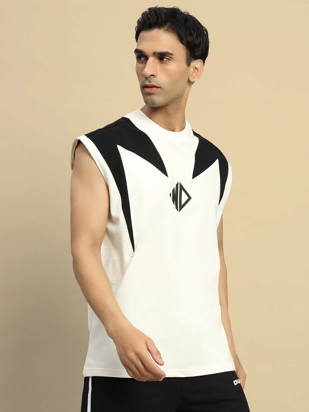 Model wearing DINO THUNDER over-sized off-white t-shirt made of premium cotton fabric, featuring bold black accents and logo design.