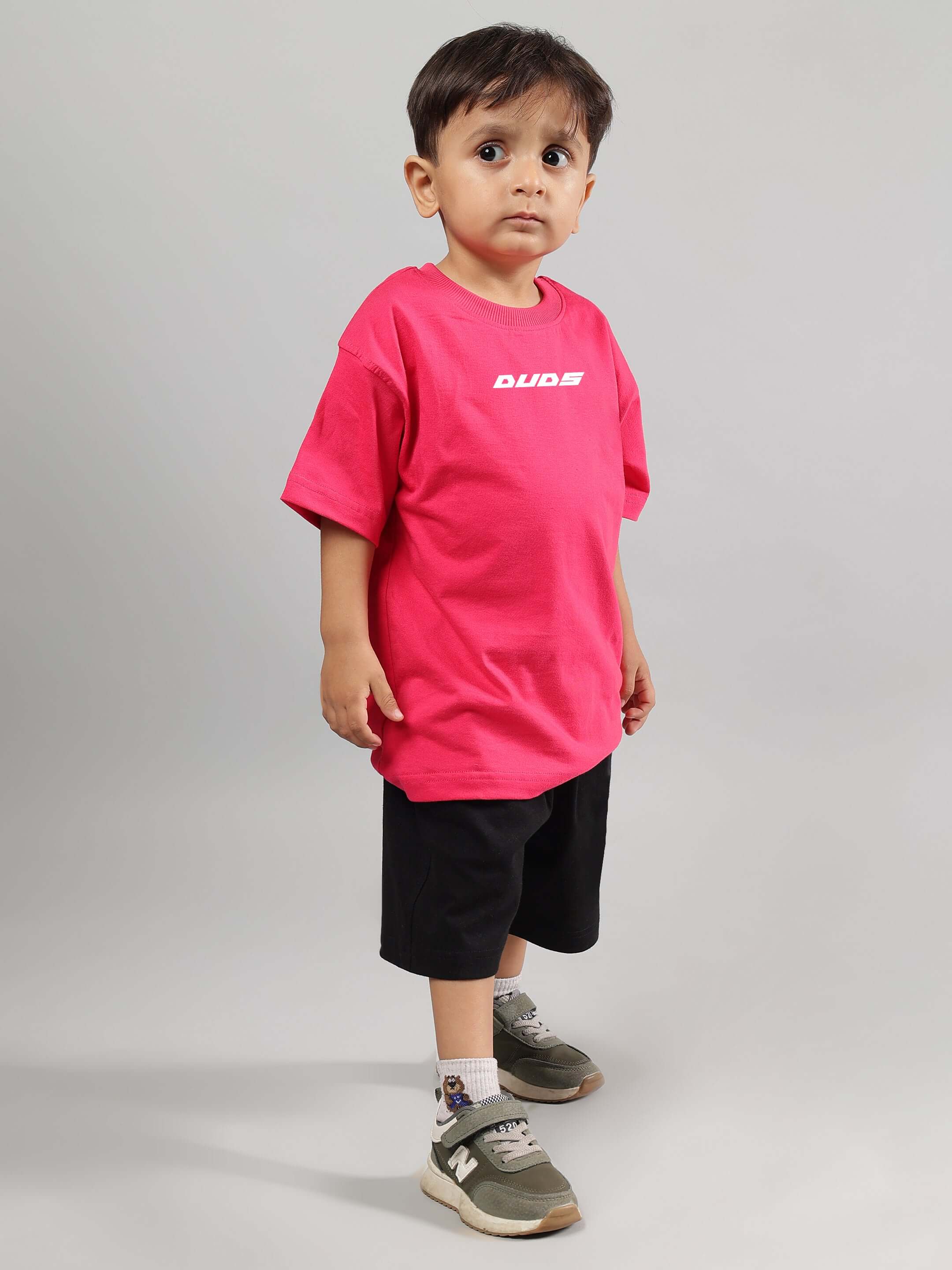 Child wearing Disney Lilo Co-Ord for Boys Girls Pink-Black, featuring pink shirt and black shorts, perfect for casual outings.