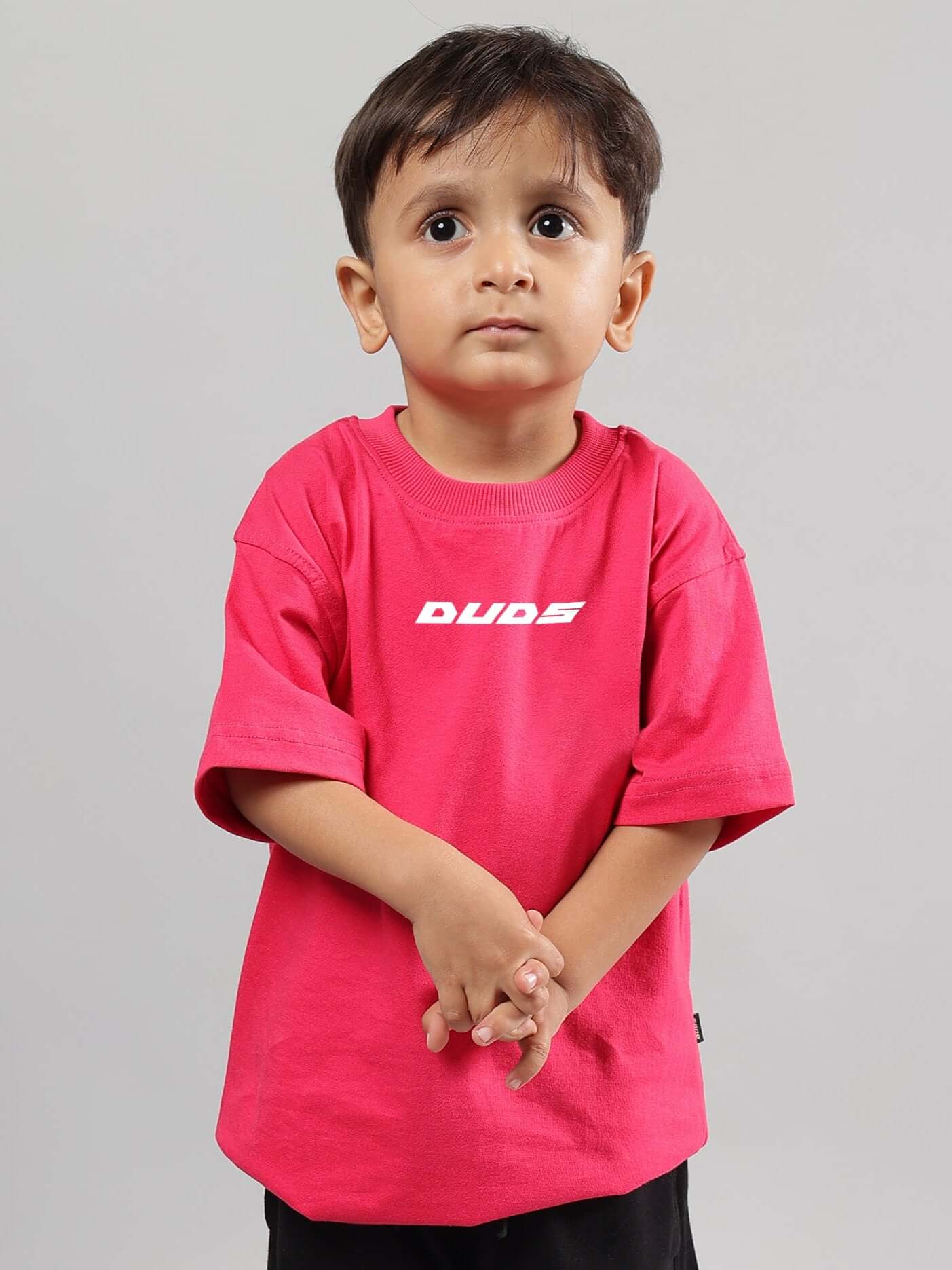 Boy wearing a pink Disney Lilo oversized t-shirt from DUDS, showcasing casual style for kids.