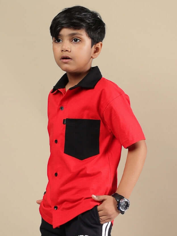 Boy wearing DORIC SHIRT FOR BOYS & GIRLS RED BLACK with contrasting collar and pocket, perfect for school or casual outings.