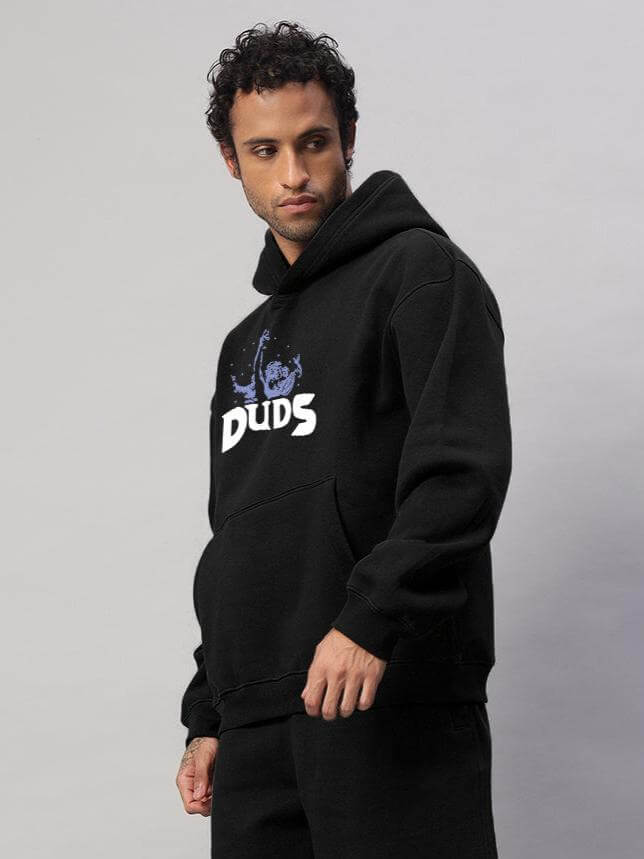 Model wearing WEARDUDS DREAMER FLEECE HOODIE BLACK, showcasing front design and comfortable fit.