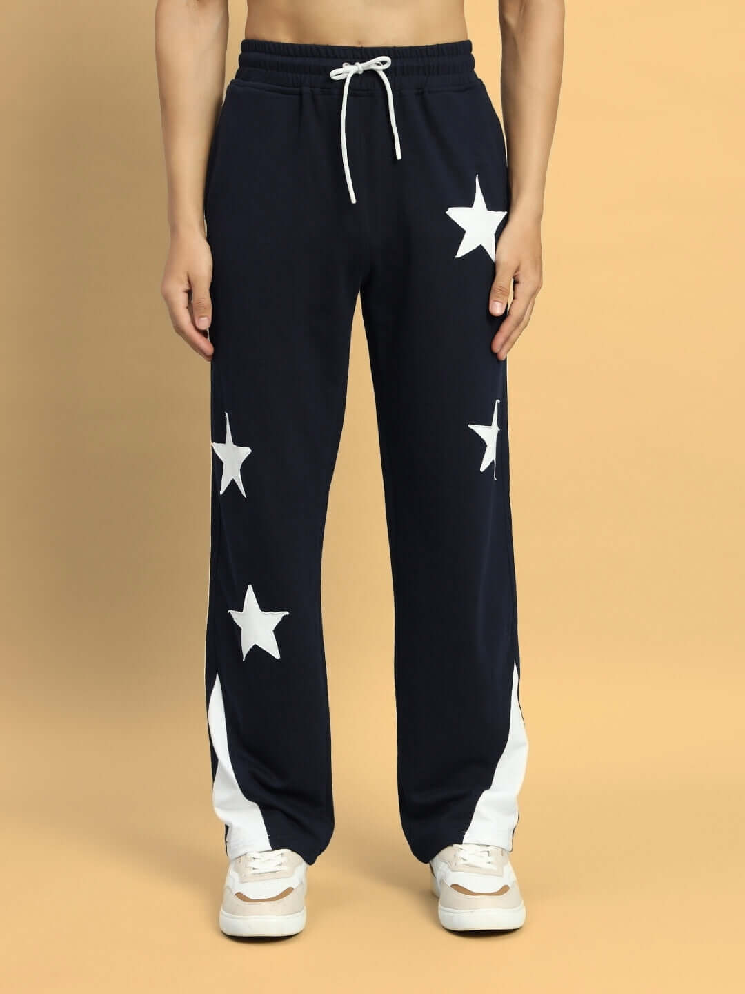 Navy blue relaxed joggers with star detailing, featuring a drawstring waist and white accents, designed for custom fit options.