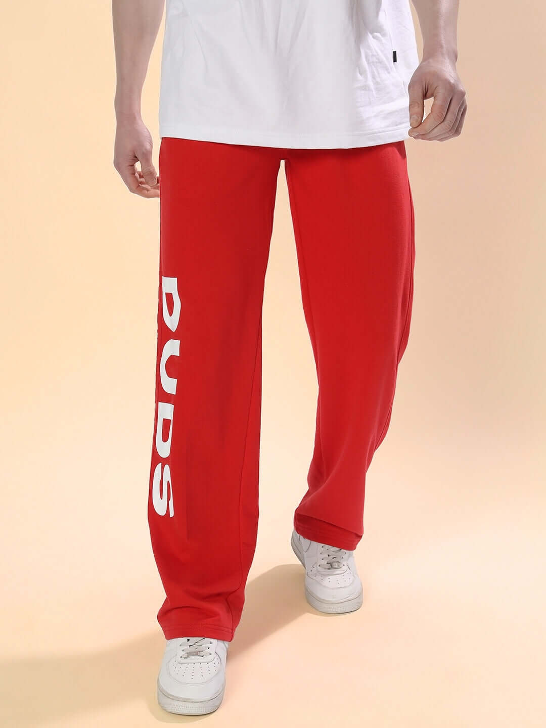 Red DUDS Limited Edition Jogger, made-to-order with a custom fit option, featuring white branding on leg, displayed on model.