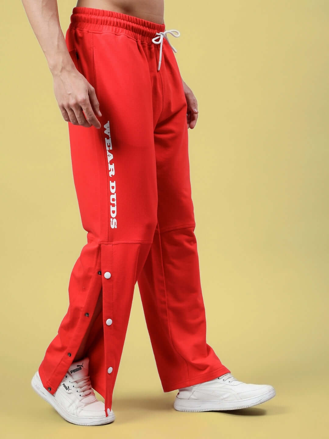 DUDS Racer Joggers in red, featuring side buttons and customizable fit options, designed by expert tailors for a unique style.