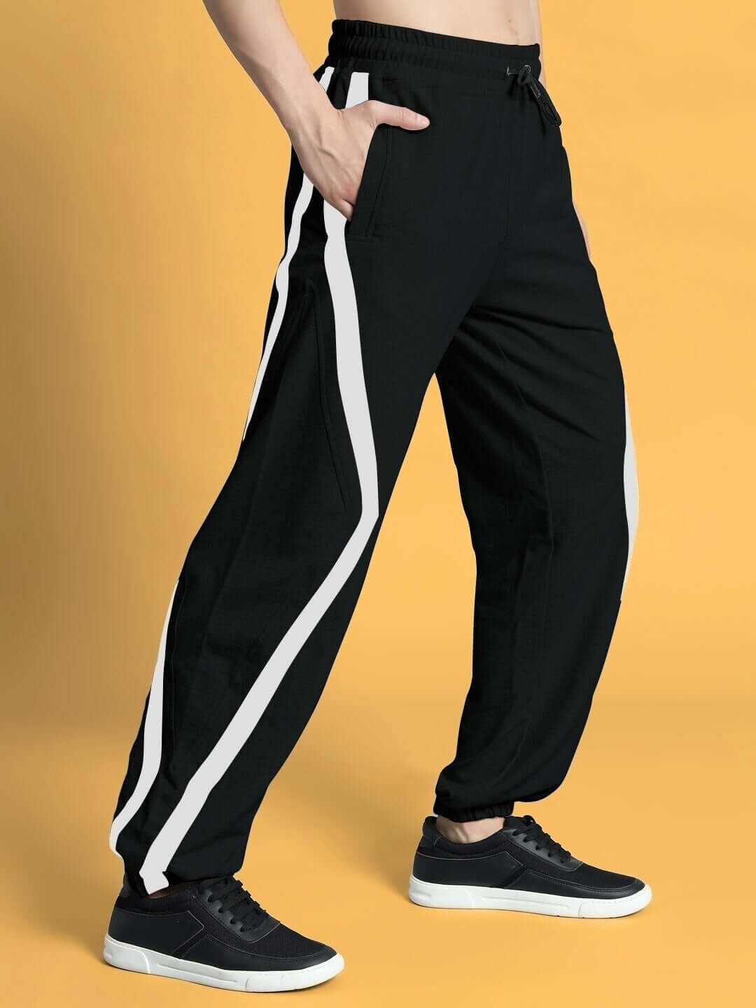 DUDS FRAME joggers in black with white stripes, customizable fit options, made by skilled tailors, perfect for a personalized style.