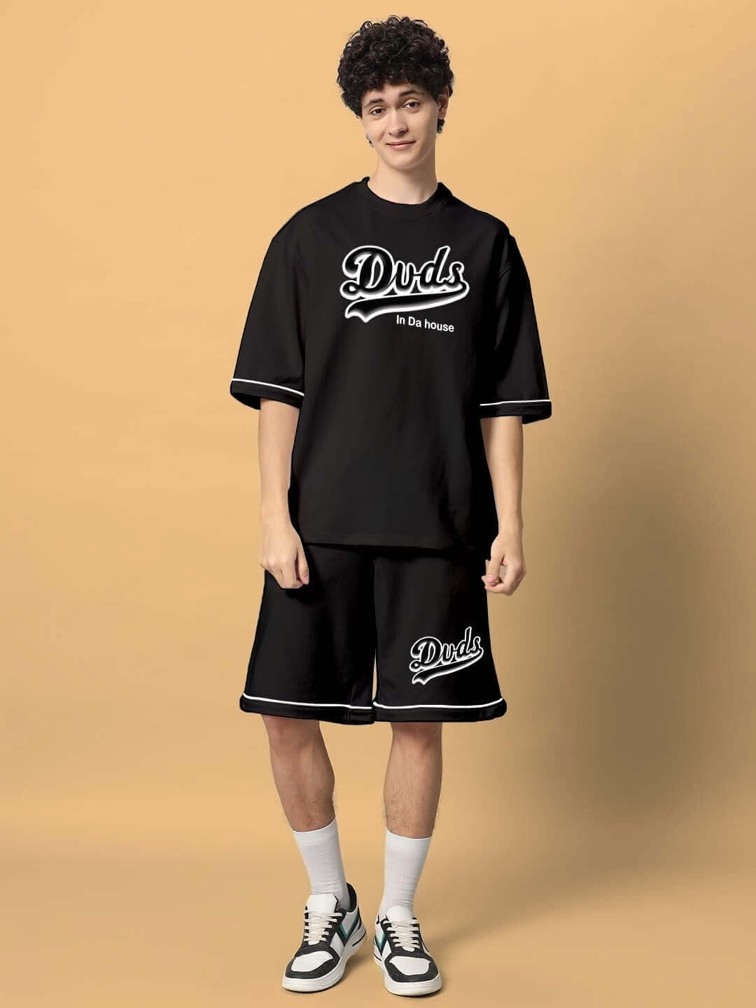 Person wearing Duds In Da House black colorblock co-ord set made of premium cotton French Terry.