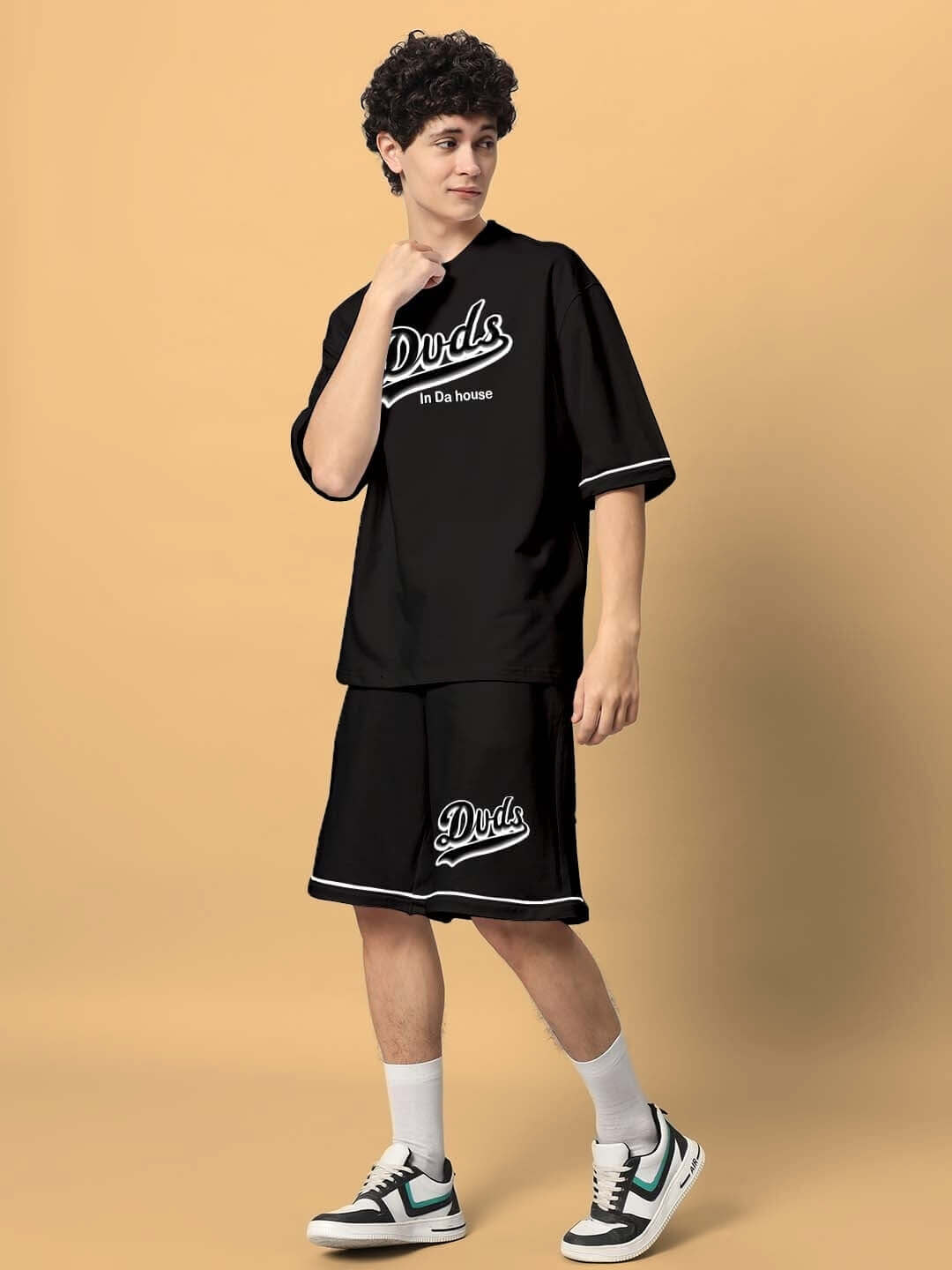 Model wearing DUDS INDA HOUSE Colorblock Co-Ord Set in black, made from premium cotton French terry with elastane, perfect for casual wear.