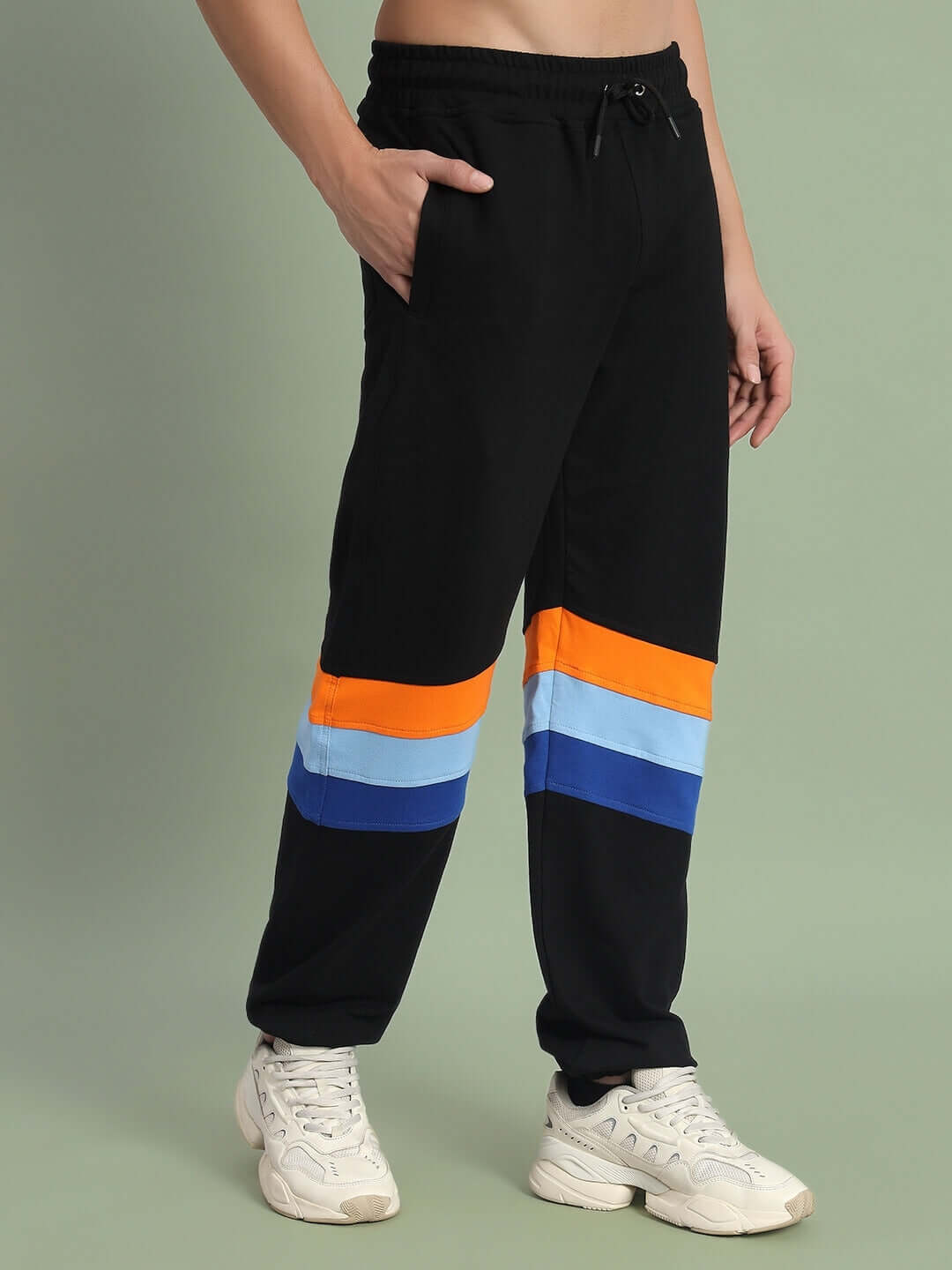 DUDS Jasper Joggers in black with colorful stripe details, worn by a model. Perfect for casual style and custom fit options available.