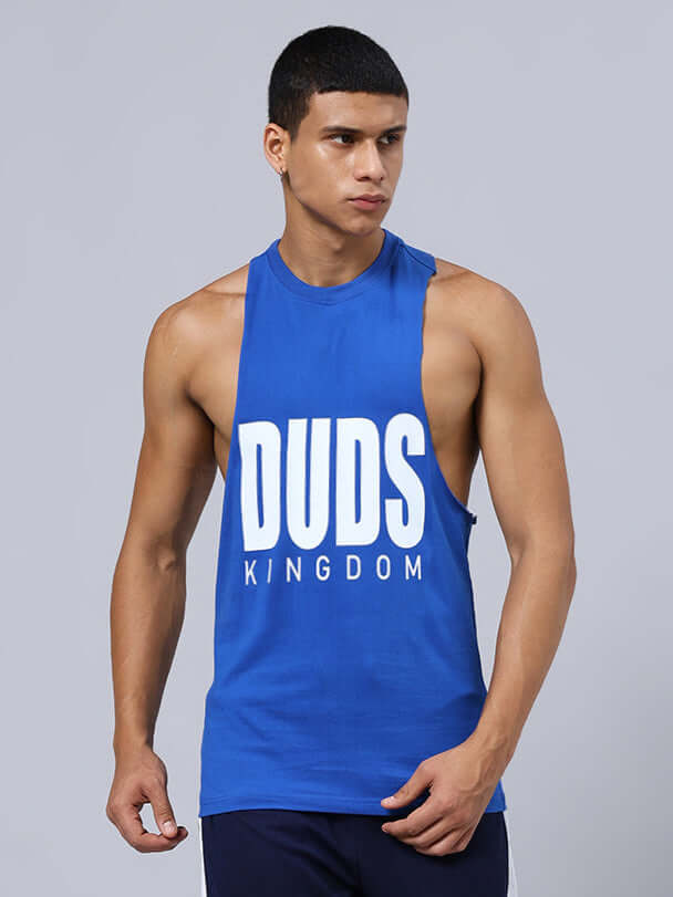 Man wearing DUDS KINGDOM GYM SLEEVELESS T-SHIRT BLUE, perfect for athletes seeking style and performance in workouts.