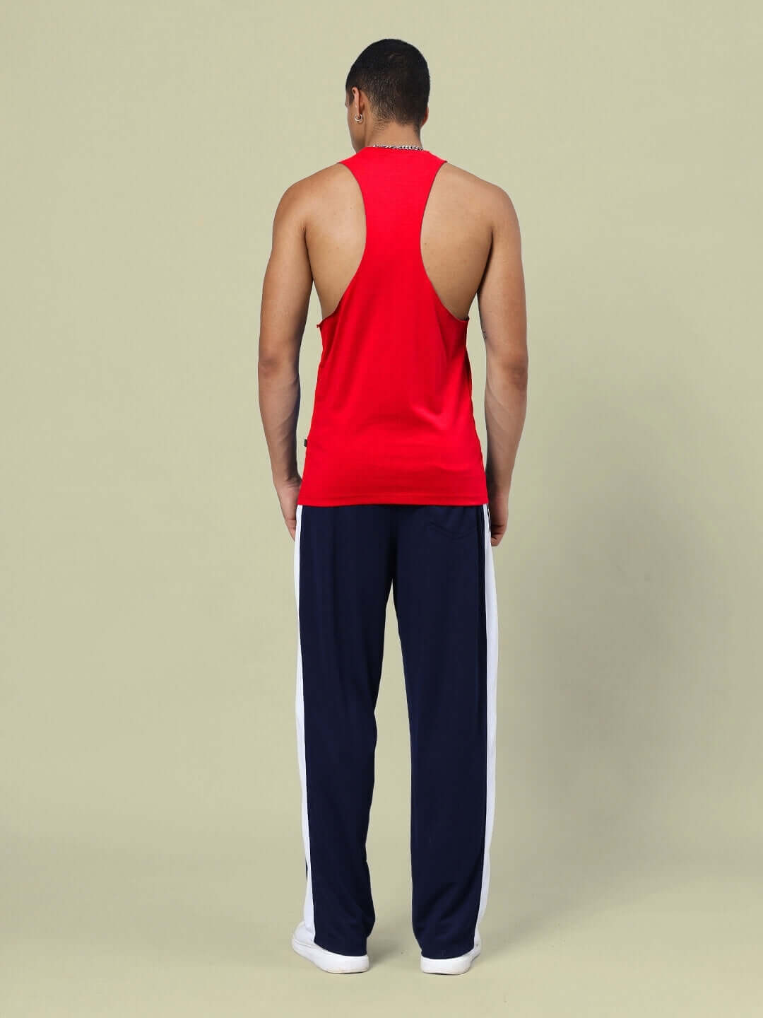 Man wearing DUDS KINGDOM GYM CO-ORD SET RED NAVY-BLUE, back view showcasing red and navy-blue athletic wear for workouts and athleisure style.