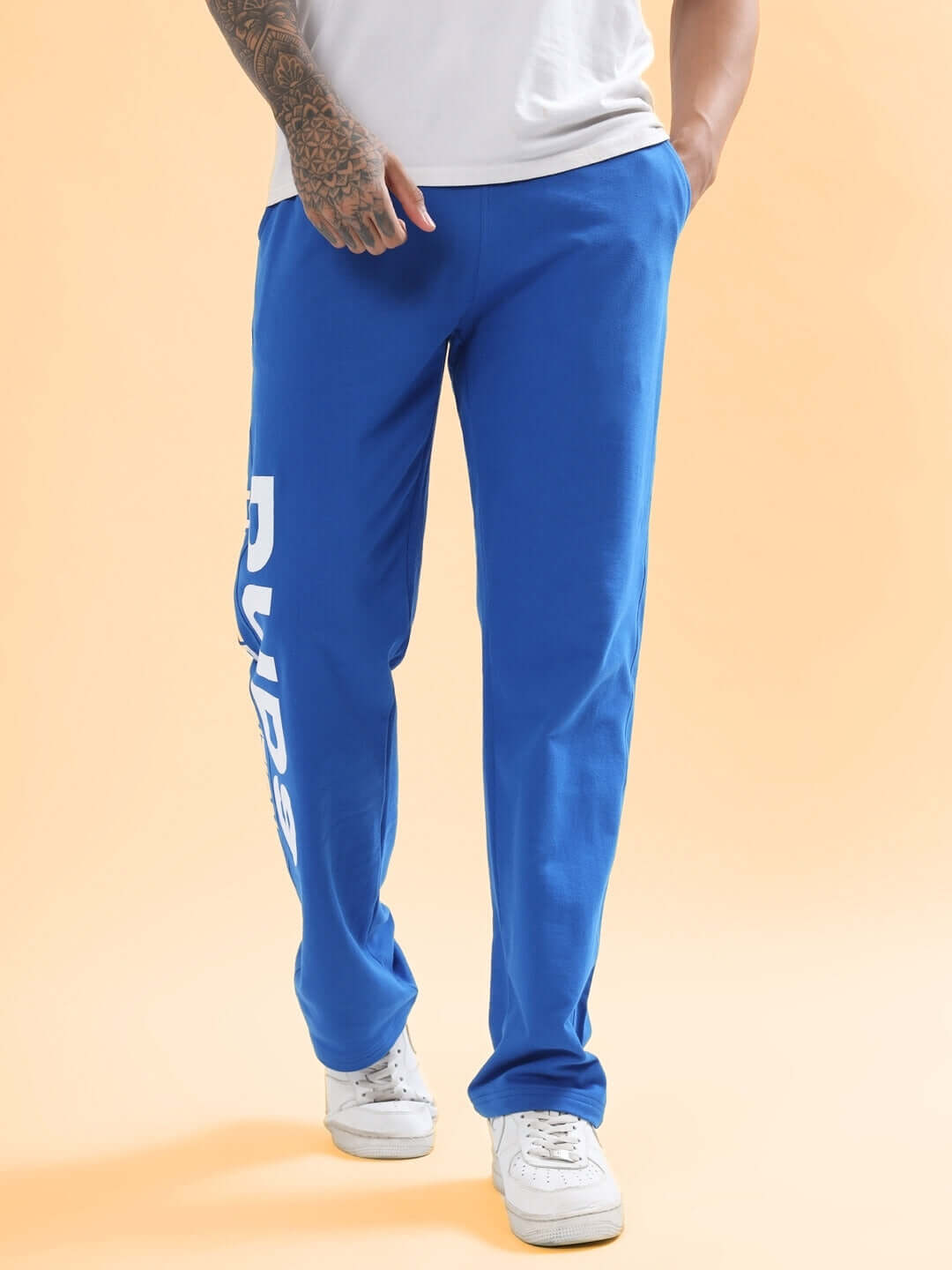 Royal blue joggers by DUDS, limited edition, worn by a model, features custom fit option, available for preorder.
