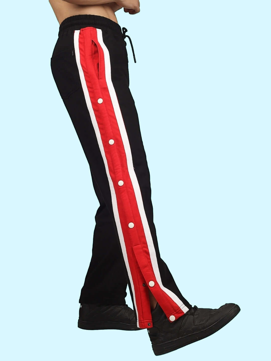 Black joggers with red and white side stripes, tailored by DUDS. Custom size available for prepaid orders.