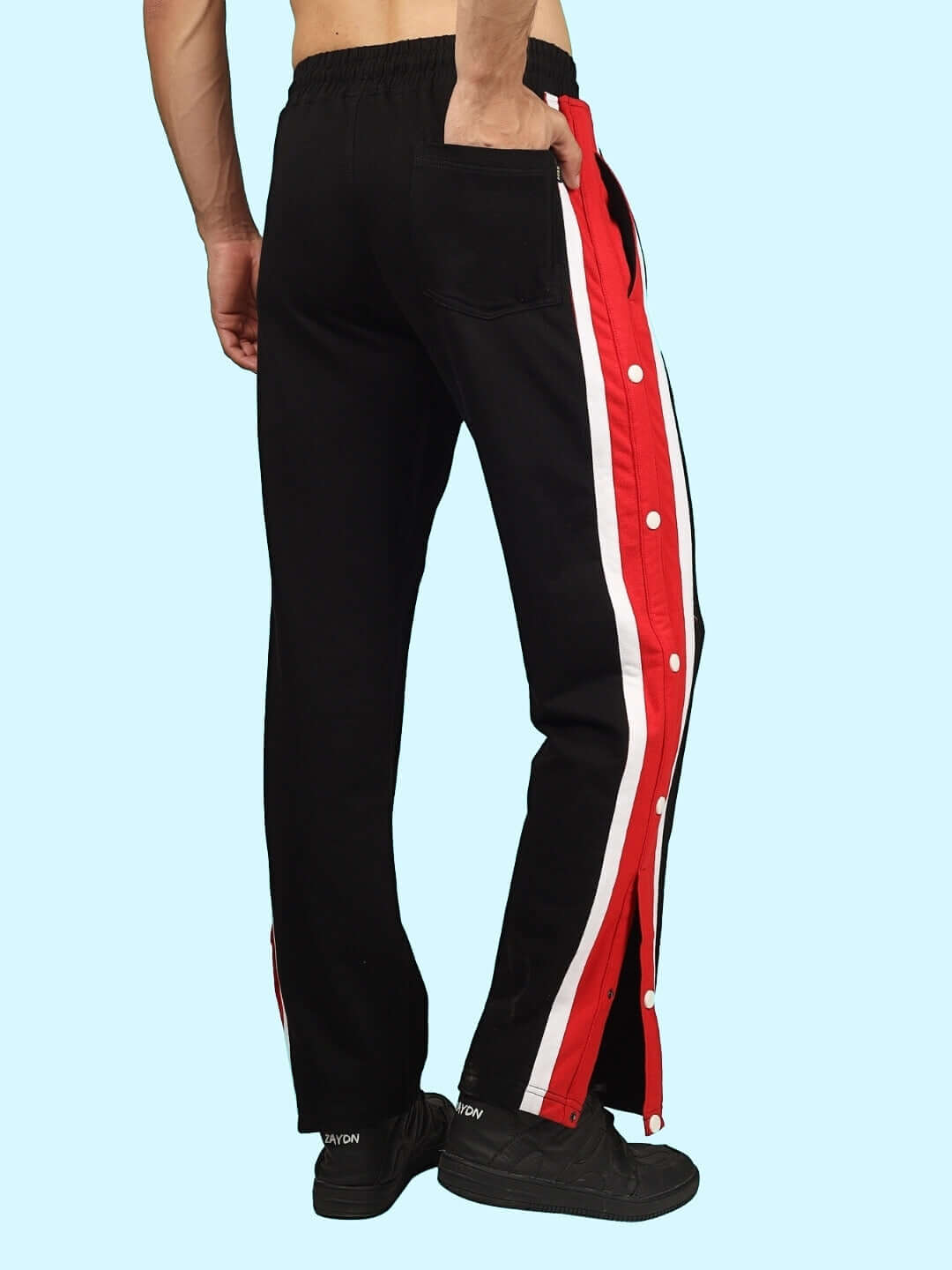 Black DUDS Magician Joggers with red and white side stripes, featuring snap buttons, shown from the back, ideal for custom fit orders.