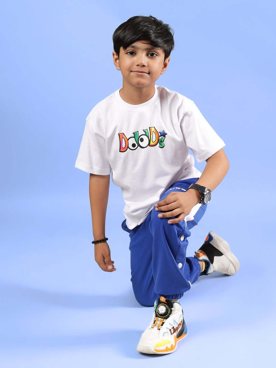 Child wearing DUDS Monster Co-ord in white and royal blue, showcasing casual fashion for boys and girls.