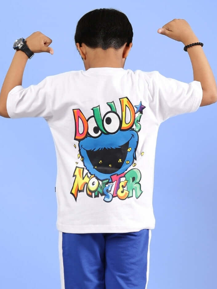 Boy wearing DUDS MONSTER T-SHIRT FOR BOYS & GIRLS WHITE, showing colorful monster design on the back.