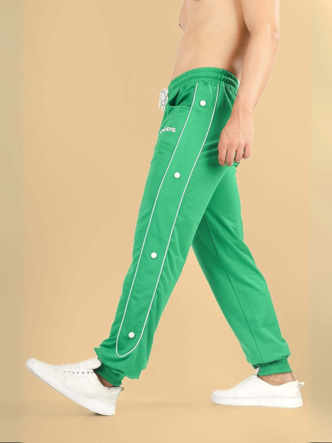 Model wearing DUDS MOON Night Joggers in green, showcasing custom fit and premium tailoring.